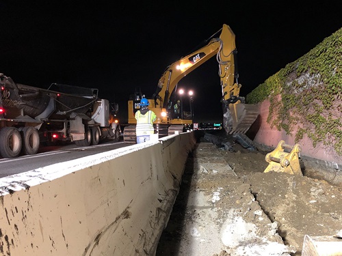 2021-04-23 Construction crews excavating in the freeway shoulder