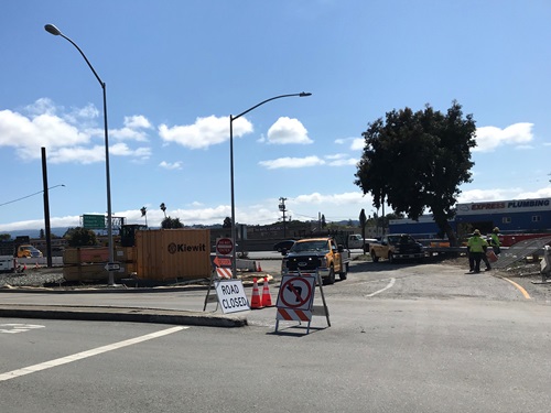 Construction crews implementing one-way traffic control on Bayshore Boulevard