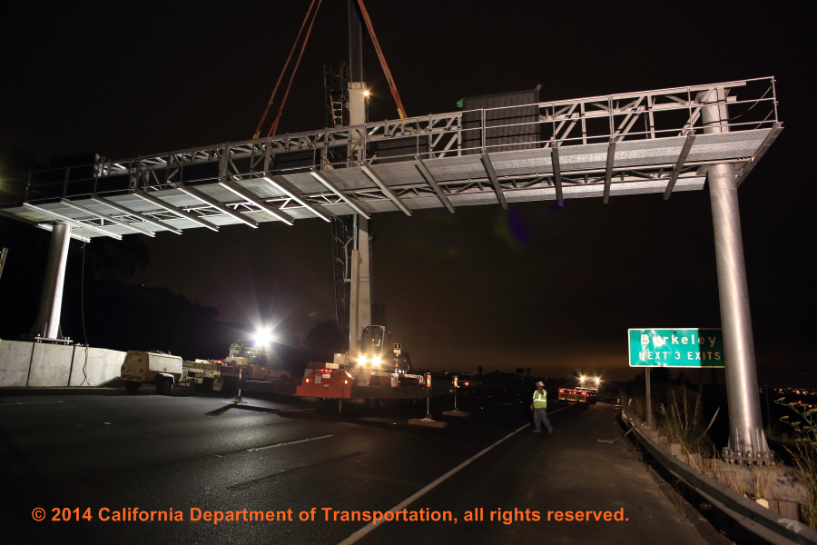 A photograph of a sign bridge being installed for a different project.
