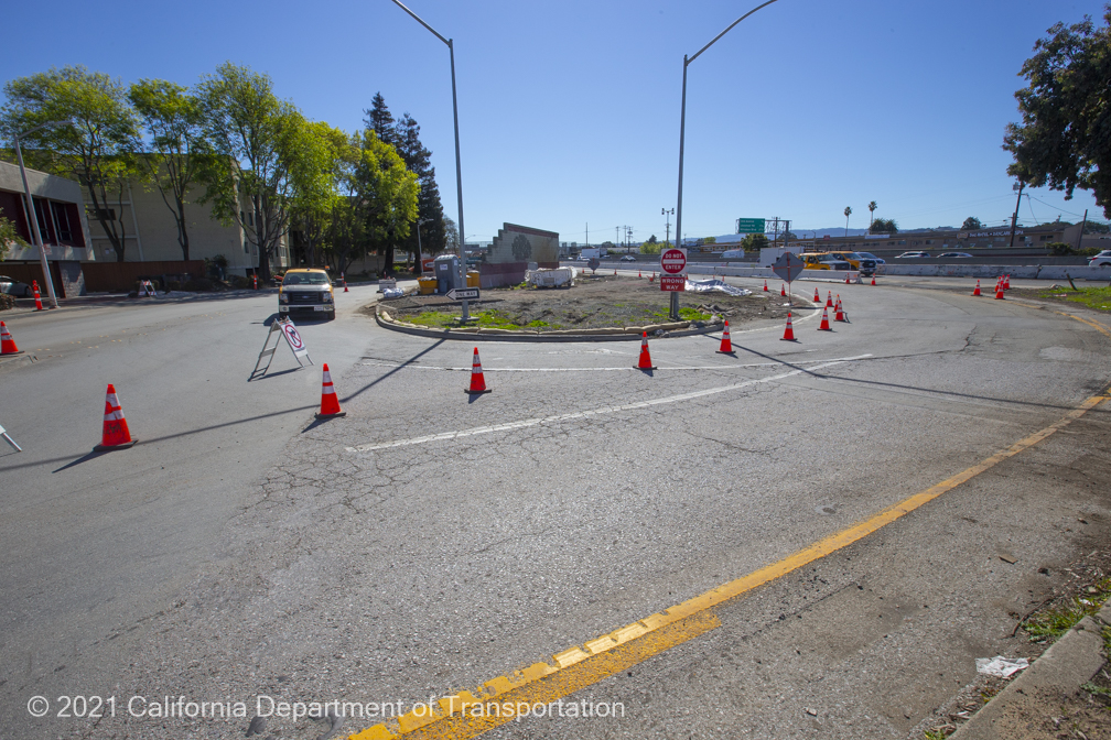 Construction crews implementing a temporary closure on city streets