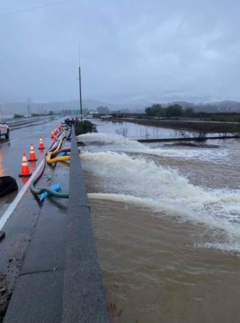 Picture of water being pumped off of State Route 37 in Marin County. Picture taken in January 2023.