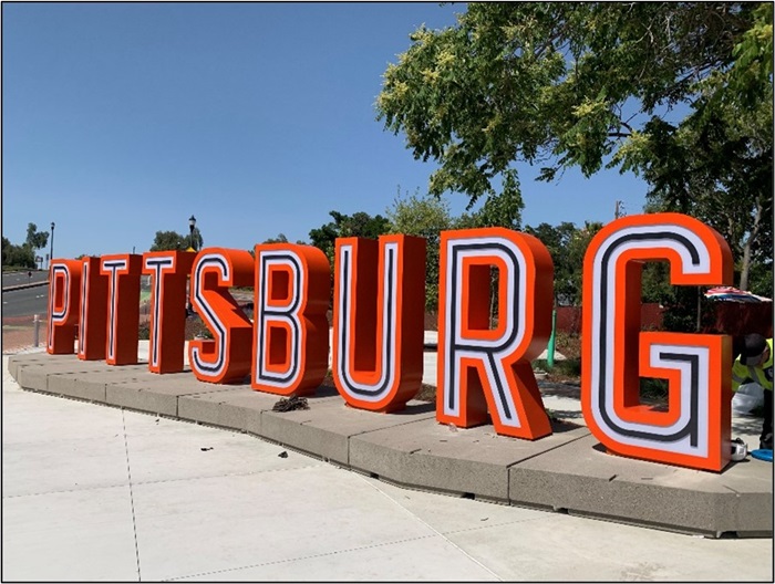 Newly unveiled 3-D Pittsburg sign, spells out the city name in large black and orange lettering and is equipped with lights for nighttime illumination.