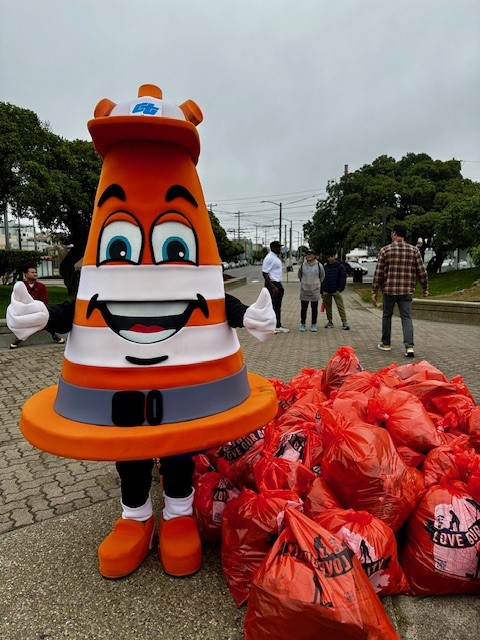 Caltrans Safety Sam Mascot at a clean up event.