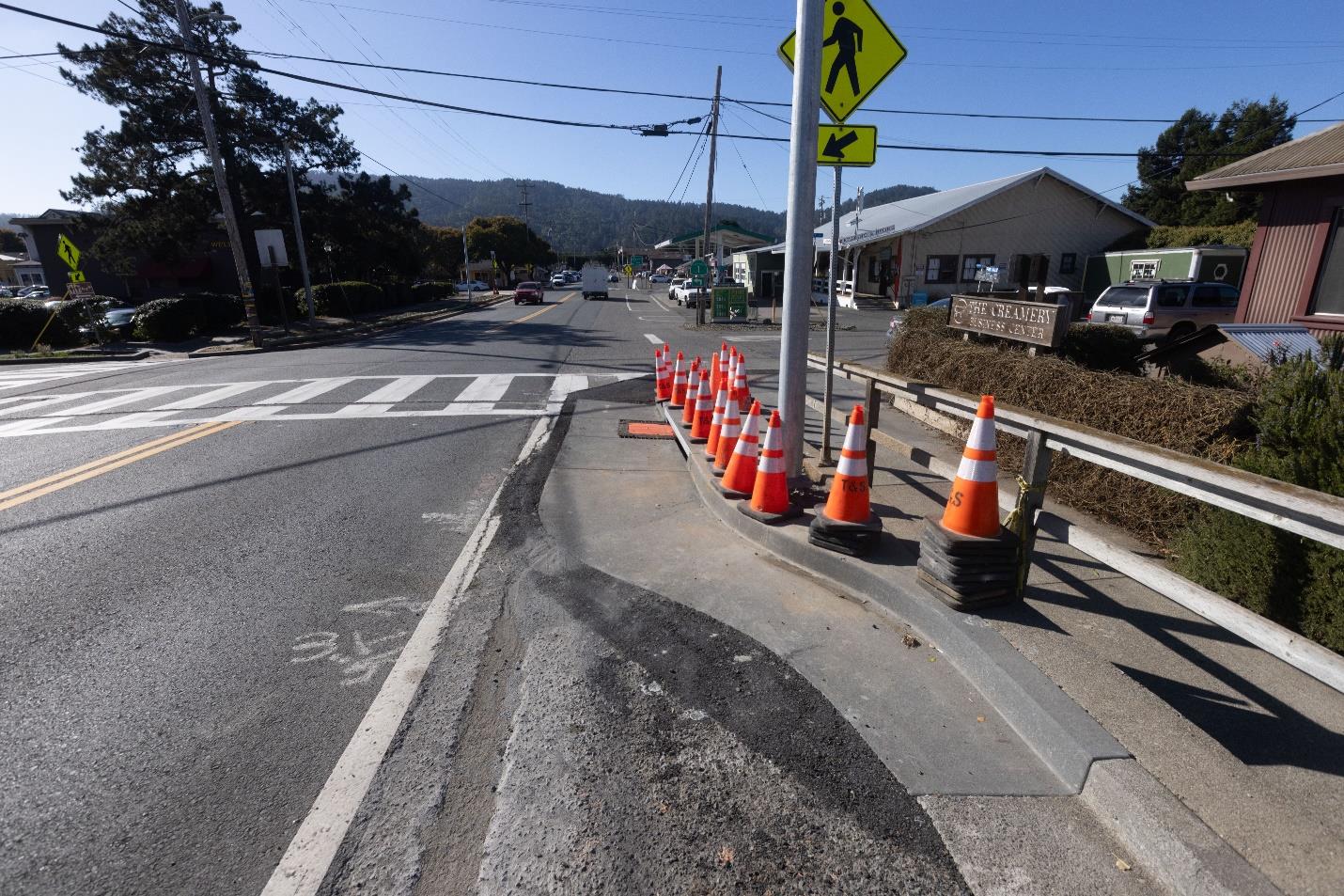 State Route 1 (SR-1)  with a line of cones where pavement resurfacing and repairs; restriping; culvert replacements to improve drainage; shoulder widening to help cyclists; guardrail, crosswalk, and signage upgrades; new signage; and sidewalk and path upgrades to meet disability access standards for the Capital Preventive Maintenance Project in Marin County