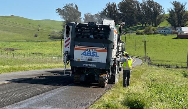 Caltrans uses heavy equipment to grind off old pavement as part of the capital maintenance project on State Route 1 in Marin County.