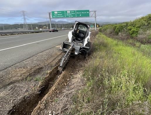 Heavy trench digger on the side of State Route 37, digging trenches for a Capital Preventive Maintenance project on Westbound and Eastbound State Route 37 (SR-37) in between Atherton Avenue and the Petaluma River Bridge in Novato.