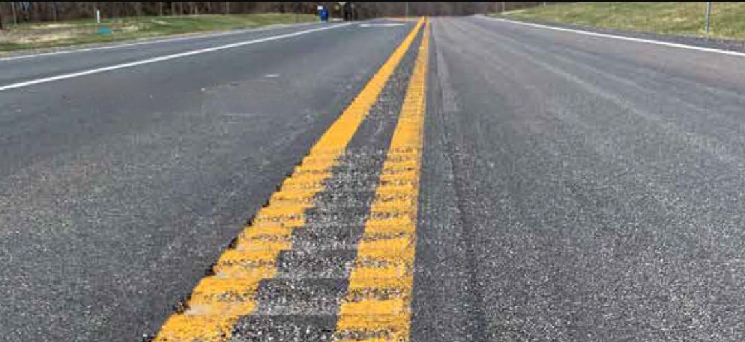 Close up image of rumble strips on the roadway.