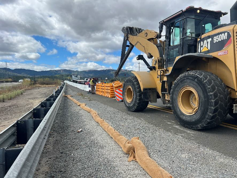 Caltrans uses heavy equipment to place barriers along State Route 37  as part of a capital preventative maintenance project in Marin County.