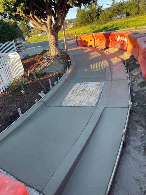 New concrete sidewalk on State Route 1 at Casa Del Mar.