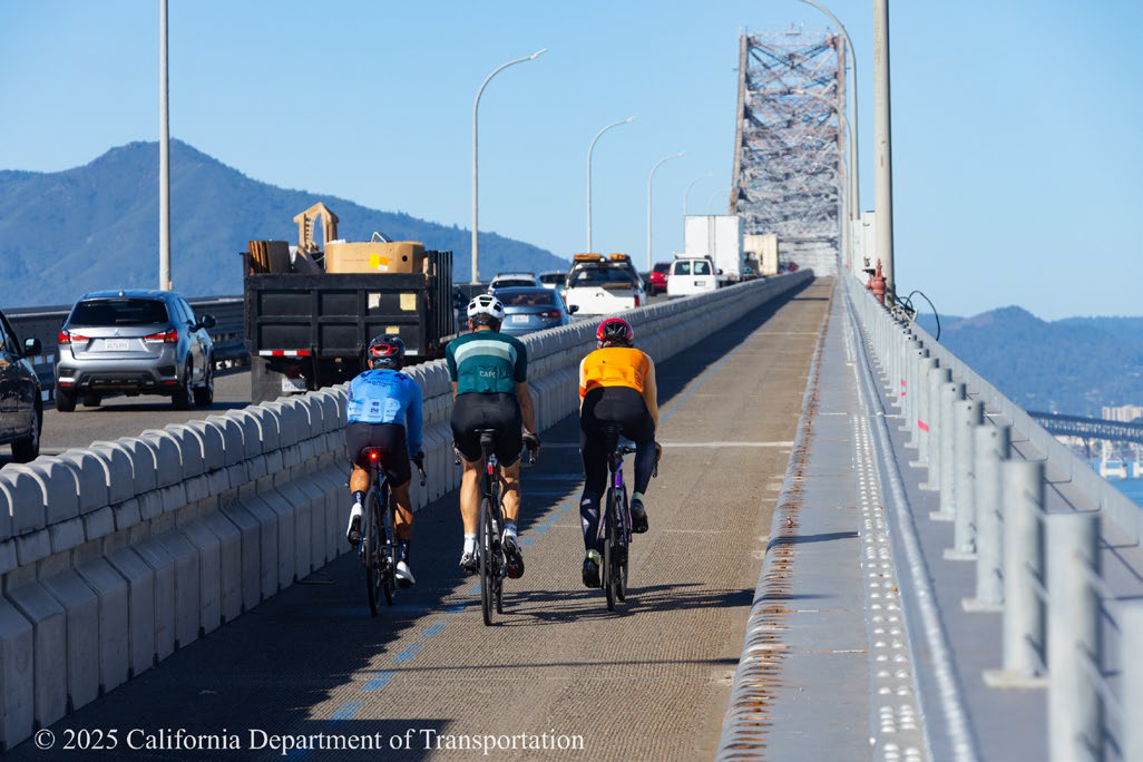 Bicyclists riding on the Richmond-San Rafael Bridge bike path.
