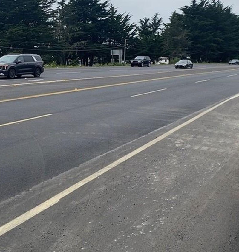 Cars traveling on newly paved road on SR-1 as progress continues on the SR-1 Multi-Asset Roadway Rehabilitation Project.