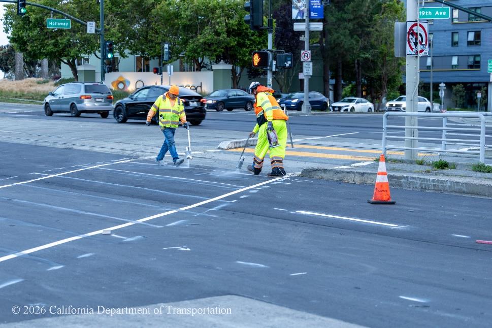 Caltrans crew spraying the asphalt on State Route 1, 19th Avenue.
