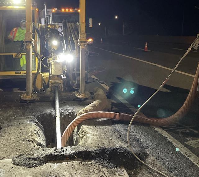 Caltrans crew using heavy equipment to dig out trench for the Middle Mile Broadband Project on State Route 1.
