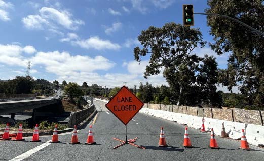 Lan closed sign and cones blocking the Appian Way Overcrossing on Interstate 80. 