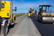 Caltrans crews work to repave westbound State Route 37 in Solano County on April 27, 2024.