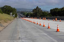 Cones on southbound Interstate 680 show where new pavement has been installed on April 28, 2024.