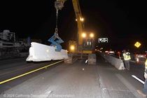 Caltrans places barriers alongside the construction area on Interstate 680 on the night of May 31, 2024.