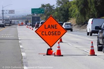 Cones and signage are used to close lanes and direct motorists on southbound I-680.