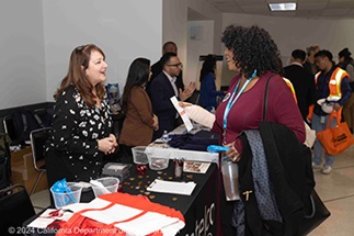 Exhibitors and attendees talk at the 2024 Equity Expo at Caltrans District 4.