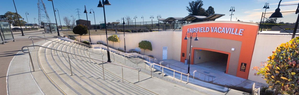 Banner image of the Suisin-Fairfield Amtrak Station entrance from the top of the stairs.