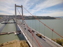 Aerial photo of the Alfred Zampa Memorial (Carquinez) Bridge looking southward from Vallejo. Construction equipment occupies the right-most lane of the roadway.