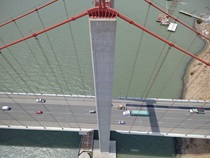 Aerial photo of the Alfred Zampa Memorial (Carquinez) Bridge taken from near the top of the northern bridge tower and looking down towards the roadway.
