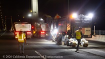 Heavy equipment and trucks are used to remove the roadway surface on the Alfred Zampa Memorial (Carquinez) Bridge on the night of August 21, 2026.