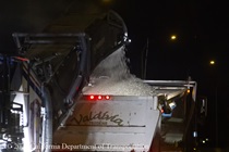 A conveyor belt dumps old the old roadway surface material into the back of a truck as part of the Alfred Zampa Memorial (Carquinez) Bridge bridge deck rehabilitation on the night of August 21, 2026.