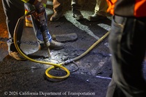 A jackhammer is used to break up the old roadway surface on the Alfred Zampa Memorial (Carquinez) Bridge on the night of August 21, 2026.