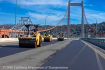 Heavy equipment is used to smooth the new roadway surface on the Alfred Zamapa Memorial Bridge as part of the bridge deck rehabilitation project on August 22, 2026.