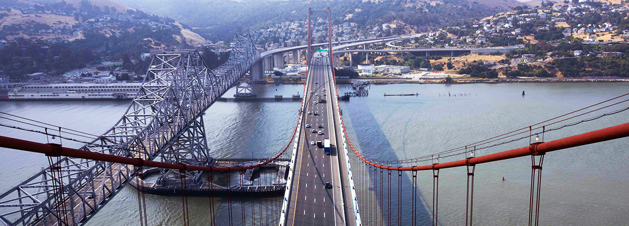The eastern and western spans of the Carquinez Bridge as viewed from the top of the North tower of the Al Zampa bridge (western span of the Carquinez Bridge) looking southward towards Contra Costa County.