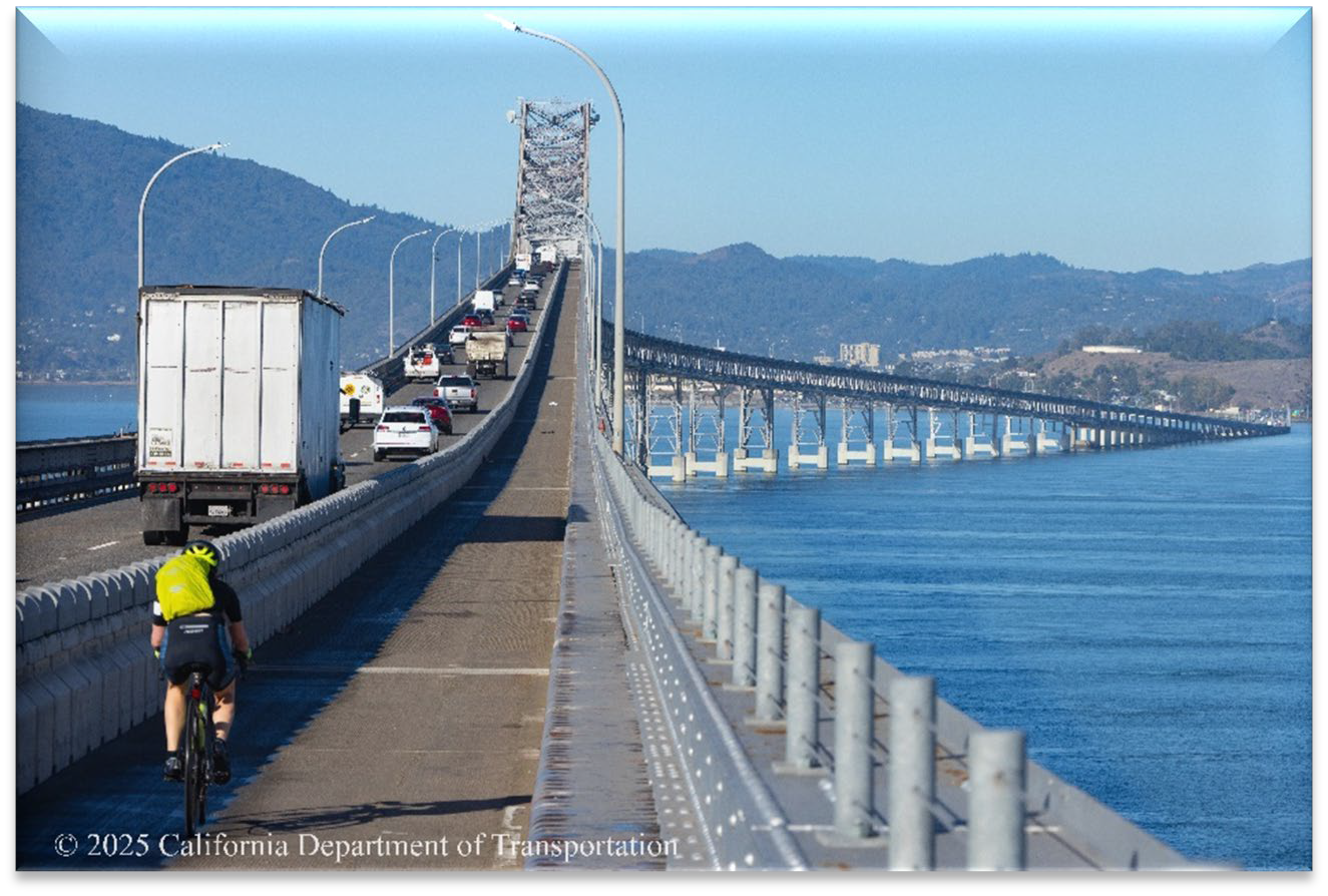 Bicyclist riding on the Richmond-San Rafael Bridge bike path lane.