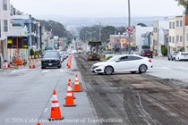 Car crossing in front of cars on 19th Avenue (State Route 1) as Caltrans is resurfacing the existing asphalt pavement on Northbound 19th Avenue from Sloat Boulevard to Lincoln Way as work continues on the19th Avenue Paving and Rehabilitation project.
