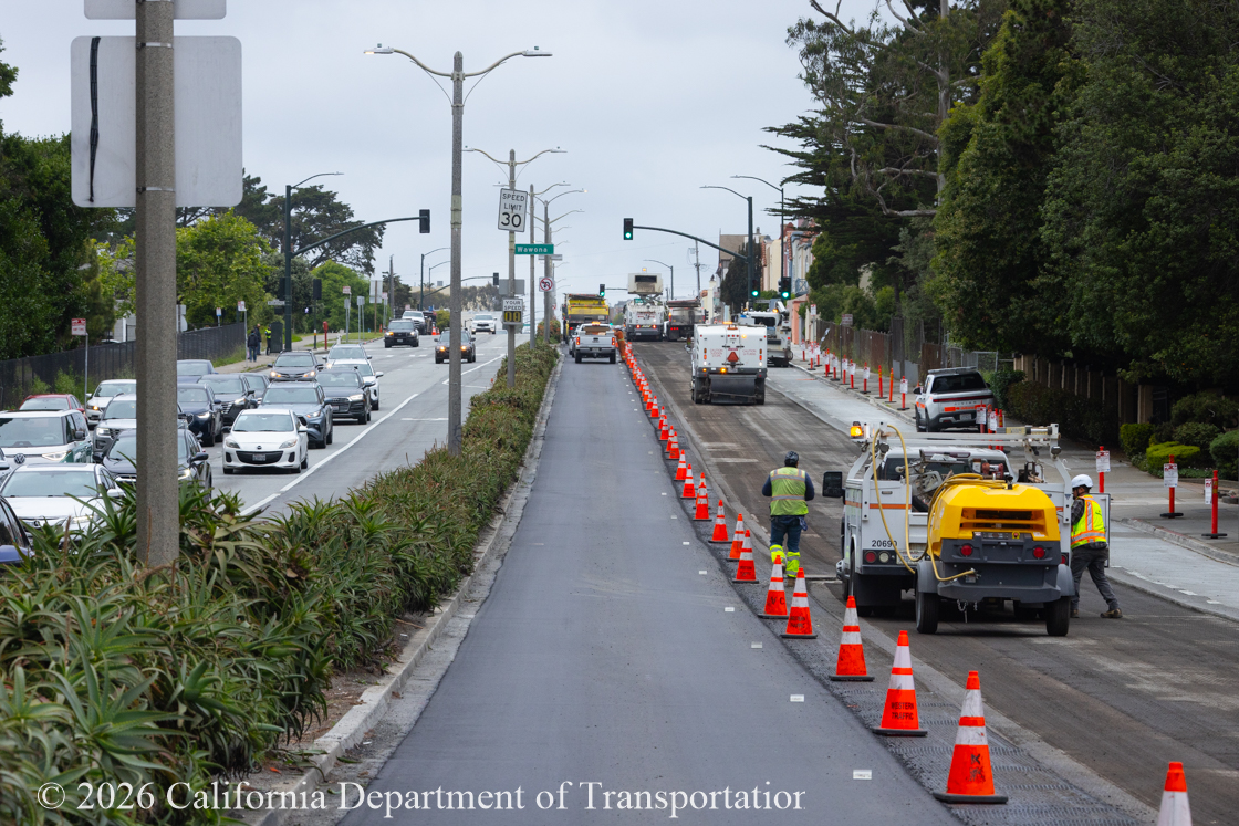 Cars traveling on resurfaced asphalt pavement on SR-1 as Caltrans uses heavy equipment to resurface the second lane on Northbound 19th Avenue from Sloat Boulevard to Lincoln Way as work continues on the 19th Avenue Paving and Rehabilitation project.