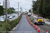 Cars traveling on resurfaced asphalt pavement on SR-1 as Caltrans uses heavy equipment to resurface the second lane on Northbound 19th Avenue from Sloat Boulevard to Lincoln Way as work continues on the 19th Avenue Paving and Rehabilitation project.
