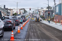 Cars traveling on resurfaced asphalt pavement on SR-1 as Caltrans uses heavy equipment to resurface the second lane on Northbound 19th Avenue from Sloat Boulevard to Lincoln Way as work continues on the 19th Avenue Paving and Rehabilitation project.