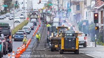 Cars traveling on resurfaced asphalt pavement on SR-1 as Caltrans uses heavy equipment to resurface the second lane on Northbound 19th Avenue from Sloat Boulevard to Lincoln Way as work continues on the 19th Avenue Paving and Rehabilitation project.