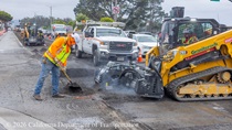 Caltrans using heavy equipment to resurface the existing asphalt pavement at an intersection on Northbound 19th Avenue from Sloat Boulevard to Lincoln Way as work continues on the 19th Avenue Paving and Rehabilitation project.