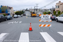 Road closed sign at an intersection where Caltrans is resurfacing the existing asphalt pavement on Northbound 19th Avenue from Sloat Boulevard to Lincoln Way as work continues on the 19th Avenue Paving and Rehabilitation project.