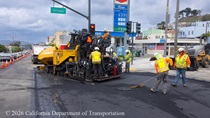 Caltrans workers using heavy equipment to resurface the existing asphalt pavement at an intersection on Northbound 19th Avenue from Sloat Boulevard to Lincoln Way as work continues on the 19th Avenue Paving and Rehabilitation project.