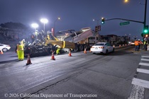 Caltrans uses heavy equipment to apply new pavement to Lane 1 of southbound Highway 1 (19th Avenue) at the intersection with Pacheco Street in San Francisco on the evening on May 8, 2026. Traffic continues to flow past the construction in Lane 3.