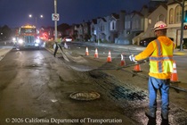 Two Caltrans crewmembers prepare the roadway for repaving on southbound Highway 1 (19th Avenue) at the intersection with Vicente Street as work continues on the 19th Avenue Paving and Rehabilitation project on the evening of May 8, 2026.