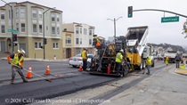 A Caltrans crew uses heavy equipment and other tools to repave the center lane of 19th Avenue (State Route 1) at the intersection with Santiago Street on May 9, 2026.