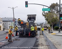 A Caltrans crew uses heavy equipment and other tools to repave the center lane of 19th Avenue (State Route 1) at the intersection with Santiago Street on May 9, 2026.