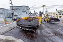 Asphalt loaded into the front of heavy equipment used in the application of new asphalt on southbound 19th Avenue (State Route 1) on May 10, 2026. 
