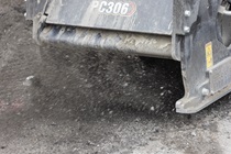 A grinder attached to heavy equipment breaks up the old roadway surface material on southbound 19th Avenue (State Route 1) on May 10, 2026.