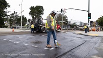 Caltrans worker marking the asphalt on Southbound/Northbound 19th Avenue from Sloat Boulevard to Holloway Avenue as work continues on the third of three weekend closures for the 19th Avenue Rehabilitation Project.