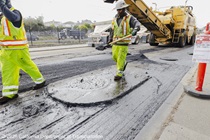 Caltrans workers using heavy equipment to prepare the resurface of SR-1 to replace the existing asphalt pavement on Southbound/Northbound 19th Avenue from Sloat Boulevard to Holloway Avenue as work continues on the third of three weekend closures for the 19th Avenue Rehabilitation Project.