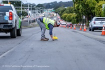 Caltrans worker prepping the surface of the new asphalt on Southbound/Northbound 19th Avenue from Sloat Boulevard to Holloway Avenue as work continues on the third of three weekend closures for the 19th Avenue Rehabilitation Project.