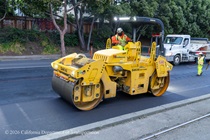 Caltrans crew using an asphalt roller to prepare and resurface the existing asphalt pavement on Southbound/Northbound 19th Avenue from Sloat Boulevard to Holloway Avenue as work continues on the third of three weekend closures for the 19th Avenue Rehabilitation Project.